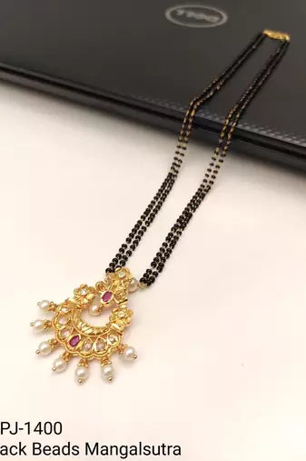 Traditional long mangalsutra with double black bead chain, gold-toned kundan ruby pearl pendant