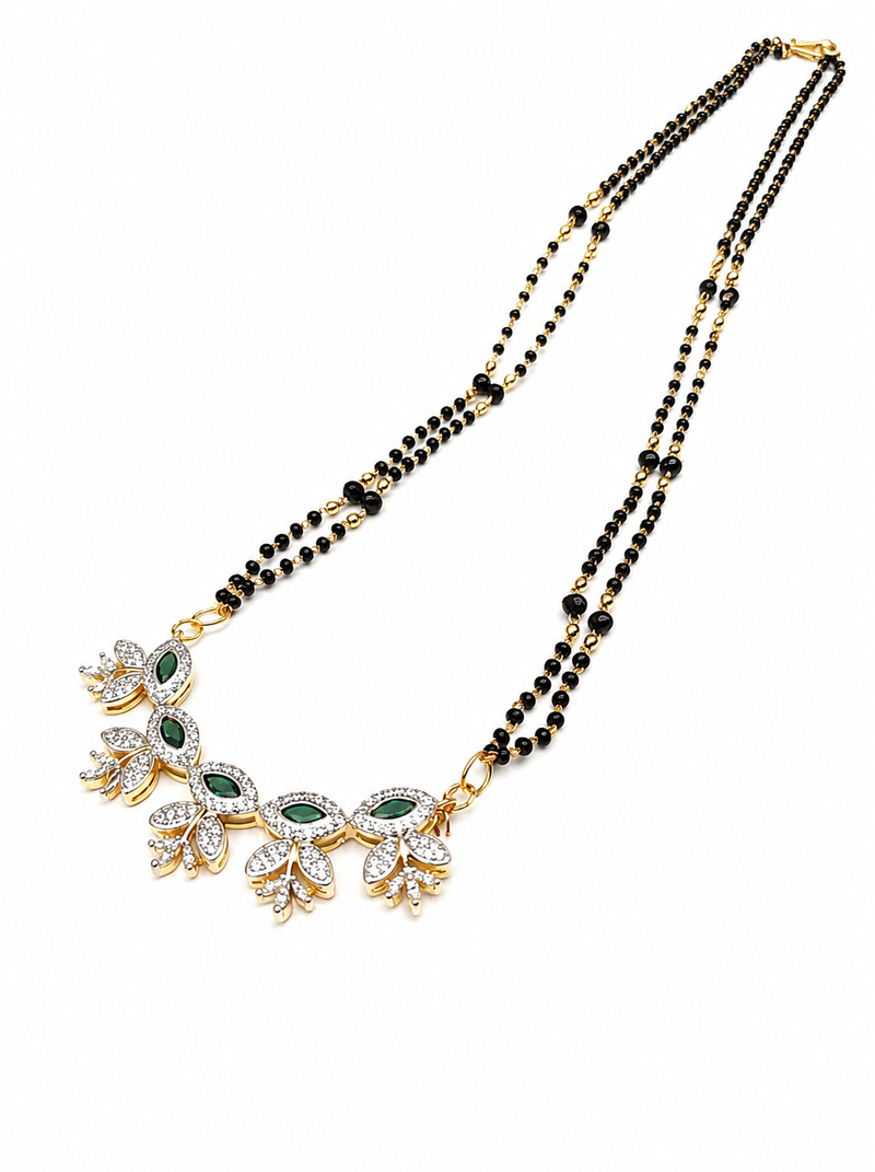 Double strand black bead mangalsutra with green & white cz floral pendant, gold-toned
