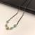 Mangalsutra with black beads chain, mint green stone pendant, gold-toned, traditional indian jewellery