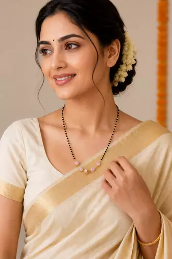 Black bead mangalsutra with rose quartz stones and gold-toned filigree pendant, traditional indian necklace