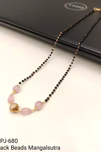 Black bead mangalsutra with rose quartz stones and gold-toned filigree pendant, traditional indian necklace