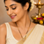 Traditional gold-plated mangalsutra with black beads, cz stone floral pendant, women's ethnic necklace