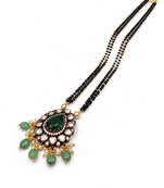 Double strand black bead mangalsutra with kundan pendant, green stone & pearl drops