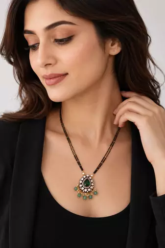 Double strand black bead mangalsutra with kundan pendant, green stone & pearl drops