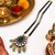 Double strand black bead mangalsutra with kundan pendant, green stone & pearl drops