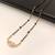 Gold-plated mangalsutra with black beads chain, cz stone pendant, traditional indian bridal jewellery
