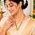 Gold-plated floral pendant mangalsutra, black beaded chain, traditional indian bridal jewellery