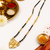 Gold-plated floral pendant mangalsutra, black beaded chain, traditional indian bridal jewellery