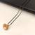 Black beads mangalsutra with gold-toned pearl pendant, traditional indian bridal necklace