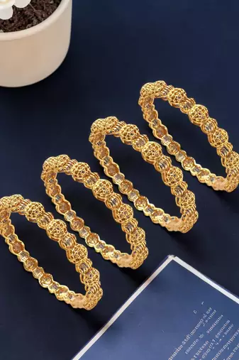 Set of 4 gold plated filigree carved style bangles