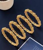 Set of 4 gold plated filigree carved style bangles