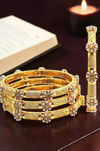 Gold plated set of 4 floral beaded bangle set