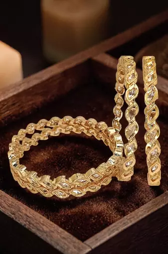 Set of 4 gold plated moissanite bangles