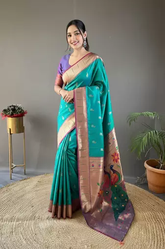 Rama green color silk blend saree with rich contrast weaving pallu & border and beautiful buttis
