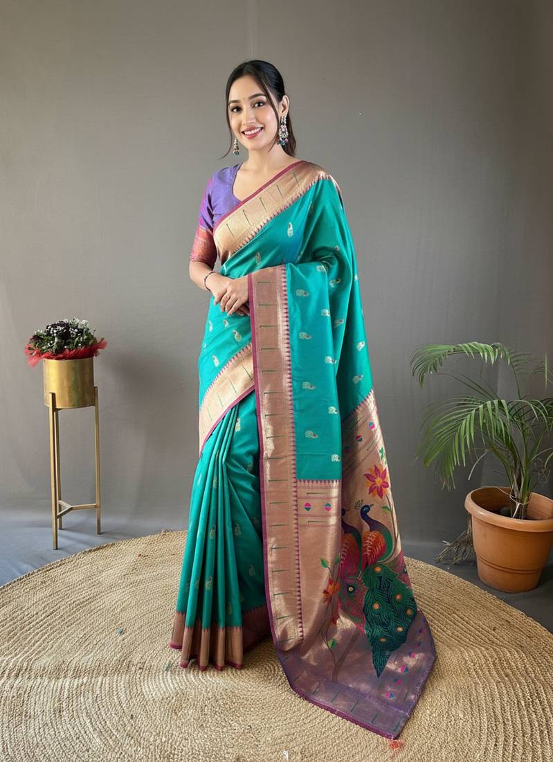 Rama green color silk blend saree with rich contrast weaving pallu & border and beautiful buttis