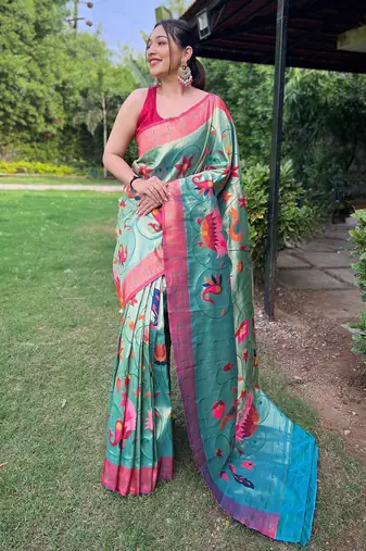 Traditional rama green silk blend saree with vibrant floral motifs