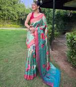 Traditional rama green silk blend saree with vibrant floral motifs