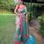 Traditional rama green silk blend saree with vibrant floral motifs