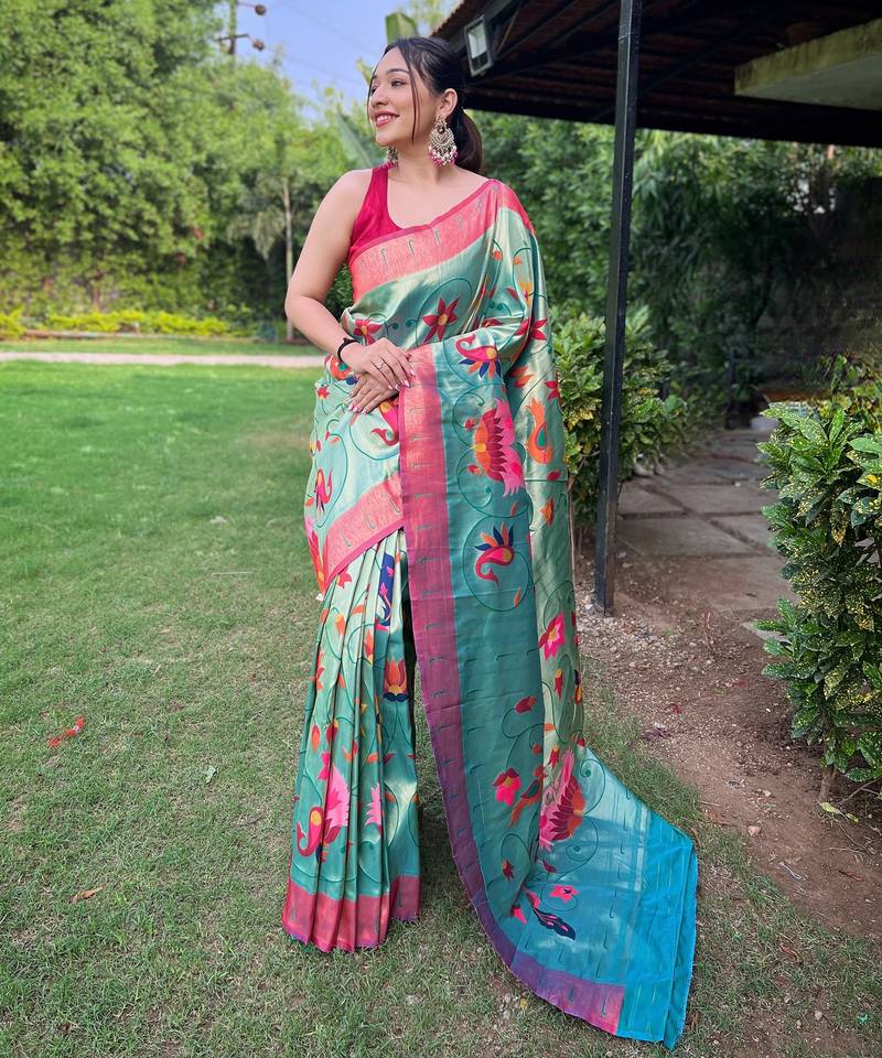 Traditional rama green silk blend saree with vibrant floral motifs