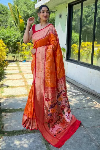 Women's orange woven silk blend saree with blouse piece