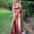 Traditional olive green silk blend saree with vibrant floral motifs