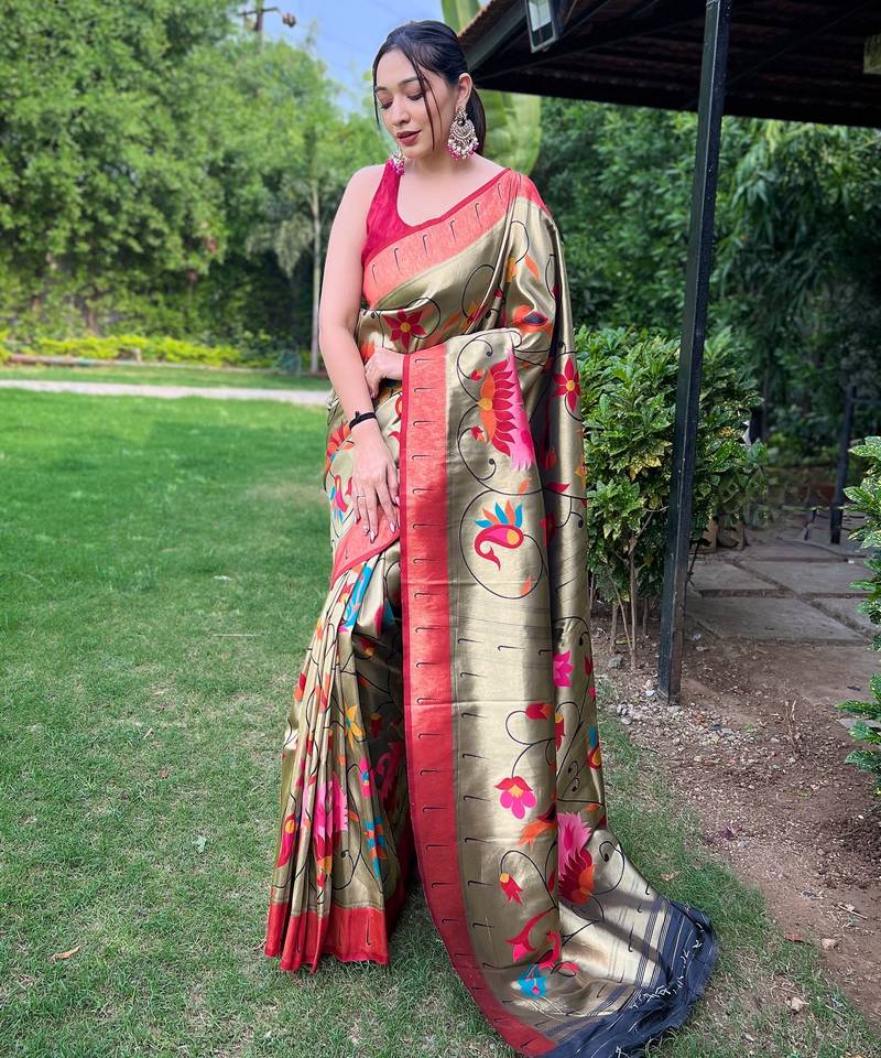 Traditional olive green silk blend saree with vibrant floral motifs