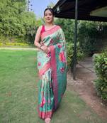 Traditional blue silk blend saree with vibrant floral motifs