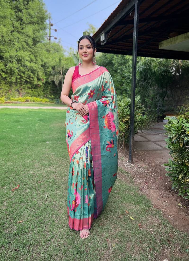 Traditional blue silk blend saree with vibrant floral motifs