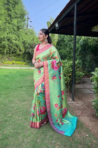 Traditional lemon green silk blend saree with vibrant floral motifs
