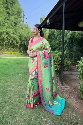 Traditional lemon green silk blend saree with vibrant floral motifs