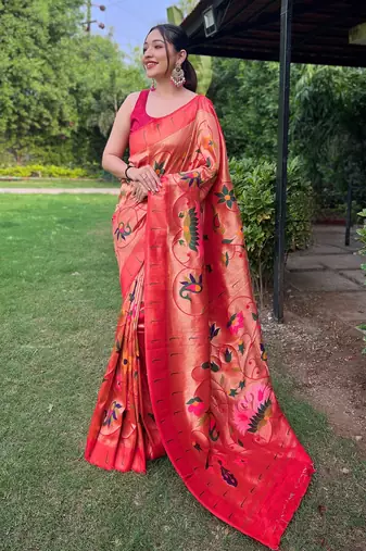 traditional red silk blend saree with vibrant floral motifs