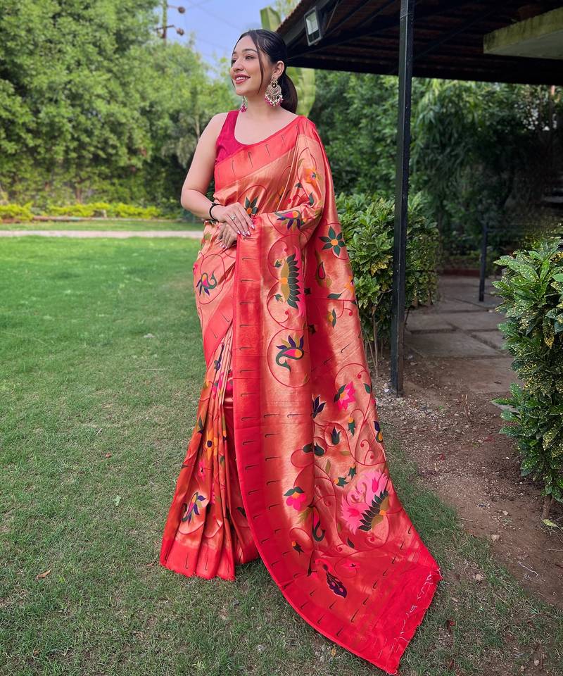Traditional red paithani saree with vibrant floral motifs