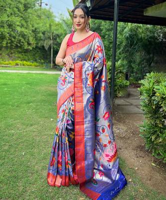 Traditional violet silk blend saree with vibrant floral motifs 1