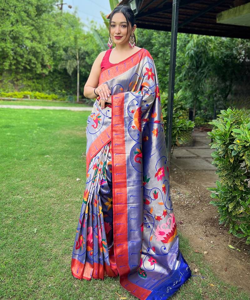 Traditional violet silk blend saree with vibrant floral motifs