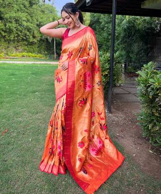 traditional orange silk blend saree with vibrant floral motifs   1