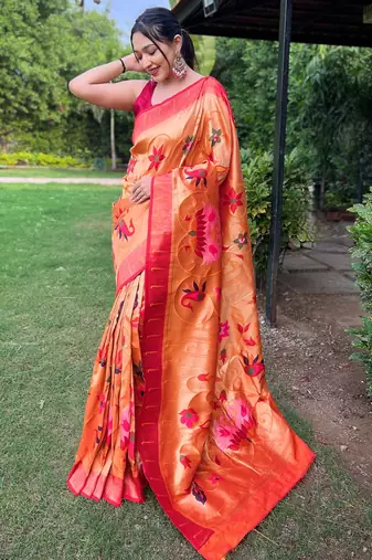 traditional orange silk blend saree with vibrant floral motifs  