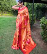 Traditional orange paithani saree with vibrant floral motifs