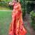 Traditional orange paithani saree with vibrant floral motifs