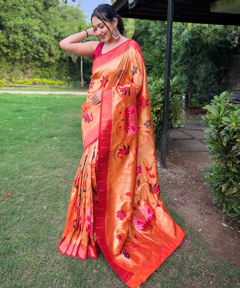 Traditional orange paithani saree with vibrant floral motifs