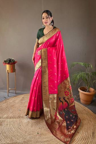 Pink color paithani silk blend saree with rich contrast weaving pallu & border and beautiful buttis