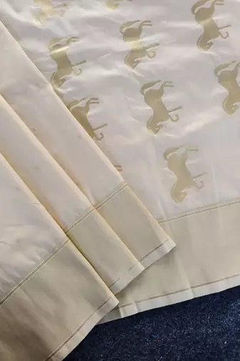 Premium white soft silk saree with golden horse motifs