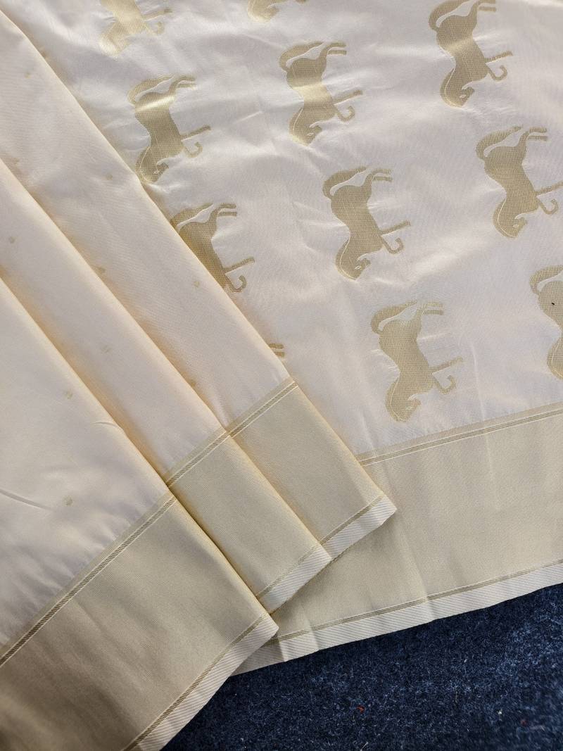 Premium white soft silk saree with golden horse motifs