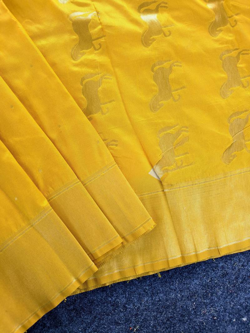 Premium yellow soft silk blend saree with golden horse motifs