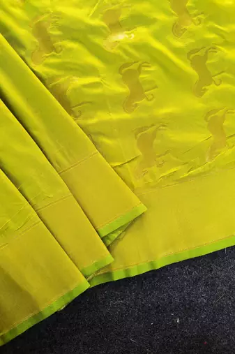 Premium lemon yellow soft silk saree with golden horse motifs