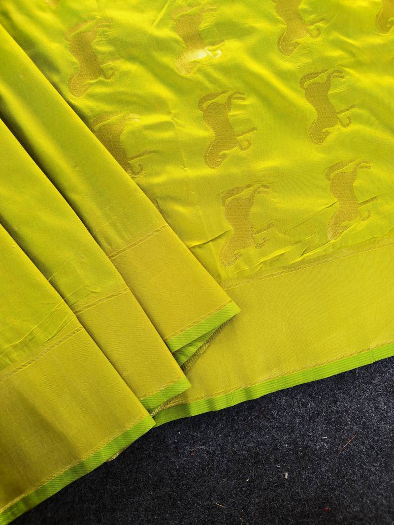 Premium lemon yellow soft silk saree with golden horse motifs