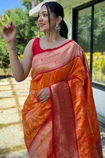 Women's orange woven silk blend saree with blouse piece