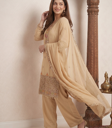 Designer beige  festive palazzo suit set with heavy embroidery