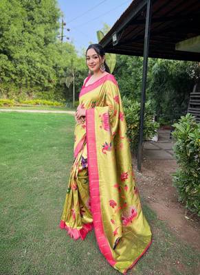 traditional pista green silk blend saree with vibrant floral motifs 2