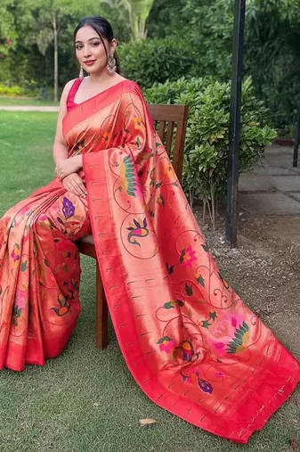 traditional red silk blend saree with vibrant floral motifs