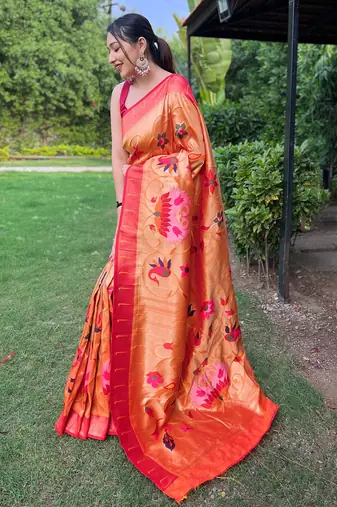 traditional orange silk blend saree with vibrant floral motifs  